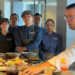 Chef Alexis Quaretti shows his staff the menu items at Aquamar Kitchen on the Marina.