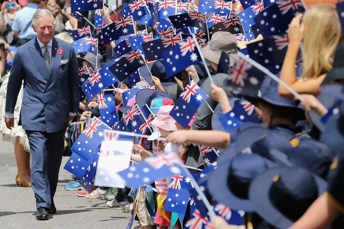 King Charles, whose Oceania royal tour may be scaled back, in Australia wearing a suit. 