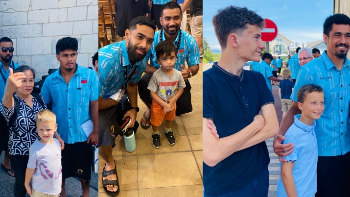 Manu Samoa players attend church in Geneva wearing blue button up Eveni shirts and ie faikaga posing with locals